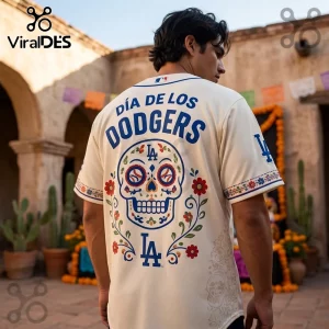 Los Angeles Dodgers Dia De Los Muertos cream baseball jersey featuring a blue sugar skull graphic and floral patterns.