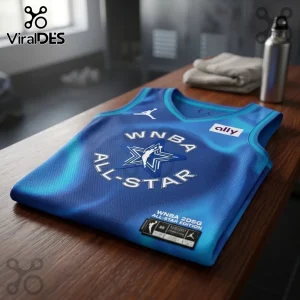 WNBA 2026 All-Star Chicago blue replica basketball jersey featuring a white star logo and Ally patch on a wooden bench.