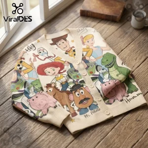 Cream knit cardigan featuring Toy Story character print including Woody, Buzz, Jessie, Bo Peep, Rex, Hamm, and Mr. Potato.!