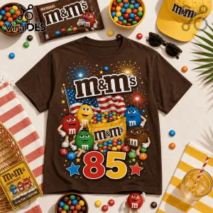 Brown cotton t-shirt featuring M&M's characters, an American flag, fireworks, and the number 85 in bold lettering.!