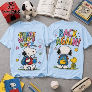 Light blue crew neck t-shirts displaying Snoopy with a backpack and text Guess Who's Back and Back Again with stars.!
