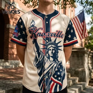 Cream baseball jersey with Statue of Liberty graphic, red, white, and blue patriotic stars, and Knoxville text print.!