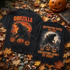 Godzilla Destroying Cities Halloween T-Shirt with front and back prints featuring jack-o'-lanterns on autumn leaves background.