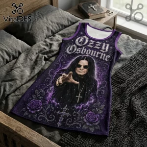 Ozzy Osbourne sleeveless tank dress with purple gothic floral print, cross, and lightning accents on a bed.!