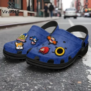 Blue foam clogs featuring Sonic the Hedgehog charms including Tails, Knuckles, Dr. Eggman, a gold ring, and 35th logo.!