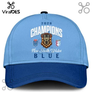 Light blue NSW Blues baseball cap featuring 2026 Champions text, an Ampol shield graphic, and team logos on a dark brim.!