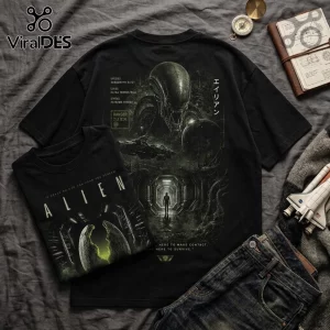 Black cotton t-shirts with Xenomorph graphic, Japanese text, and Alien franchise branding on a grey fabric background.!