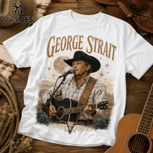 White cotton t-shirt featuring a George Strait graphic with a cowboy, acoustic guitar, full moon, and desert roses.!