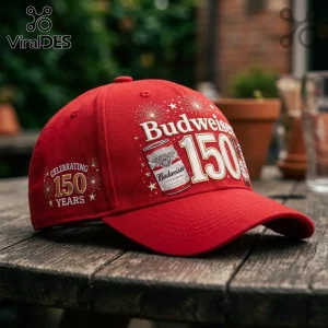 Budweiser 150th Anniversary Red Baseball Cap featuring white 150 branding, gold fireworks, and a beer can illustration.