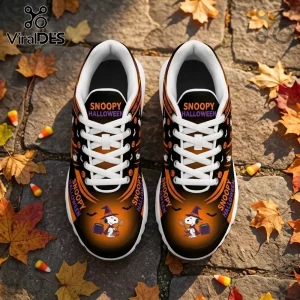 Snoopy Halloween sneakers with black and orange ombre print, featuring a witch Snoopy, pumpkins, and bats on stone path.!