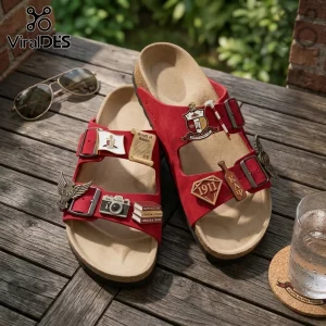 Red suede double-strap sandals with cork footbeds and metal Kappa Alpha Psi fraternity charms on a wooden deck.!
