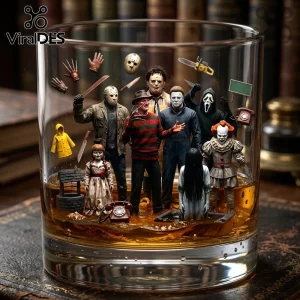 Clear whiskey glass featuring miniature horror movie villains including Freddy Krueger, Jason Voorhees, and Pennywise.!