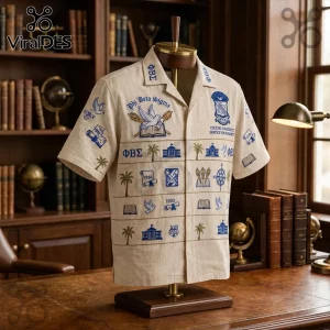 Beige button-down shirt with embroidered Phi Beta Sigma fraternity symbols and text on a wooden mannequin in a library.!
