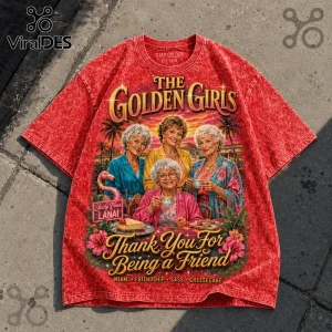 Red acid-wash t-shirt featuring The Golden Girls graphic, Miami sunset background, tropical foliage, and printed text.!