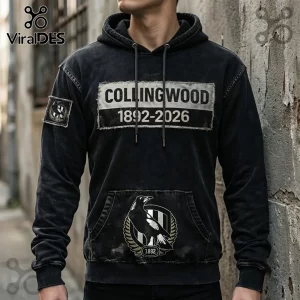 Collingwood Magpies 1892-2026 Distressed Black Hoodie with vintage patch chest graphic and magpie emblem on front pocket.