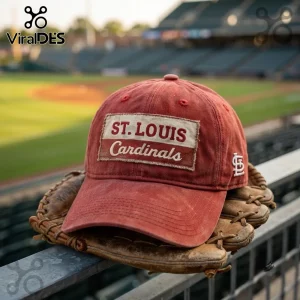 MLB St. Louis Cardinals Distressed Red Baseball Cap featuring a front patch logo resting on a leather baseball glove.