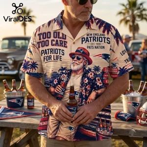 New England Patriots Too Old Too Care Hawaiian shirt in beige with navy blue tropical patterns and football team graphics.
