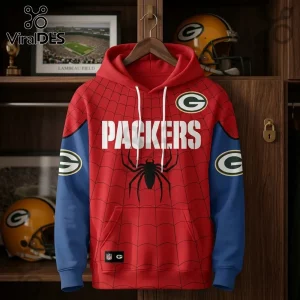 Green Bay Packers x Spider-Man Brand New Day Hoodie features a red spiderweb pattern, Packers logo, and blue sleeves.