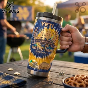 Notre Dame Fighting Irish 184th Anniversary Tumbler with blue and gold tie-dye pattern, helmet graphic, and straw lid.