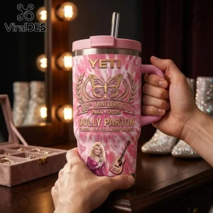 Dolly Parton 80th Anniversary Pink Tie-Dye YETI Tumbler with butterfly graphics, acoustic guitar, and metallic lid.