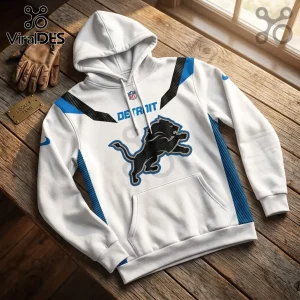 Detroit Lions Nike White Performance Hoodie featuring a black lion logo, blue side panels, and NFL branding on wood table.