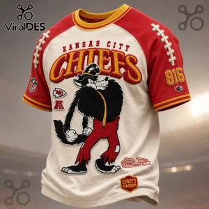 Kansas City Chiefs NFL Mascot Embroidered Shirt with wolf graphic, red sleeves, and Chiefs Kingdom text on cream fabric.