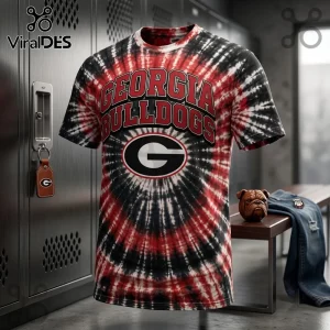 Georgia Bulldogs NCAA Red and Black Tie Dye Shirt featuring a large G logo and collegiate text in a locker room setting.