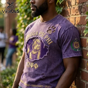 Omega Psi Phi Fraternity Mascot Distressed Shirt in purple with gold bulldog graphic, Greek lettering, and sleeve emblem.