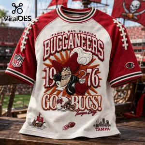 Tampa Bay Buccaneers 1976 Embossed Shirt featuring vintage pirate logo, red sleeves, and football lace shoulder detailing.