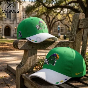 Tulane Green Wave 2026 City Edition Mardi Gras hat with green crown, white brim, and team mascot embroidery on wood bench.