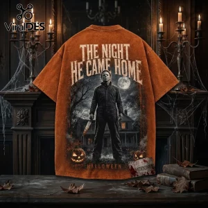 Michael Myers Halloween Horror Movie T-Shirt 2026 features a vintage orange wash with a graphic of Michael Myers and house.