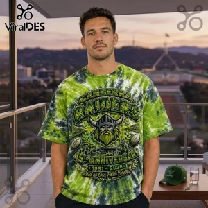Canberra Raiders 45th Anniversary Tie Dye Shirt featuring green and black swirled patterns with a Viking logo graphic.