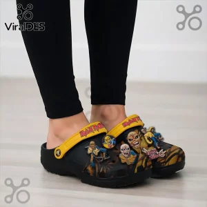 Iron Maiden Eddie Mascot Crocs Clogs Shoes featuring black foam base, yellow heel straps, and metal band character charms.