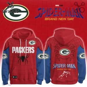 Green Bay Packers x Spider-Man Brand New Day Hoodie showing red spider-web fabric with team logos and superhero graphics.