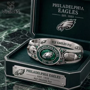 Philadelphia Eagles Silver Tone Engraved Bracelet featuring a central team logo on a green stone with football motifs.