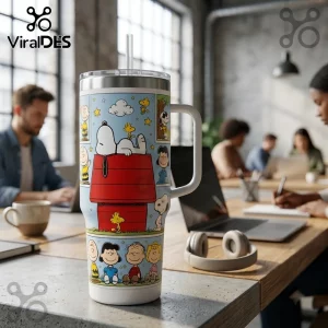 Peanuts Snoopy and Friends 40oz Stanley Tumbler featuring Snoopy on his doghouse with colorful comic strip character panels.
