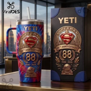 Superman 88th Anniversary Tie Dye 40oz Tumbler with Yeti branding and Daily Planet graphics on a table.