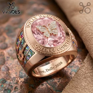 Dolly Parton Queen of Country butterfly ring in rose gold with a pink center stone, guitar side inlay, and text engraving.