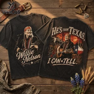 Willie Nelson He Is From Texas Vintage Washed T-Shirt featuring country singer portrait and graphic scenery on dark fabric.