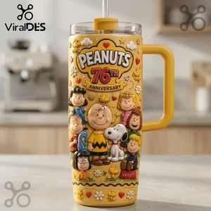 Peanuts 76th Anniversary Yellow Stanley Tumbler featuring Charlie Brown, Snoopy, and friends with 3D-style character art.