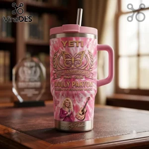 Dolly Parton 80th Anniversary Pink Stanley Tumbler featuring butterfly art, guitar graphics, and signature on tie-dye steel.