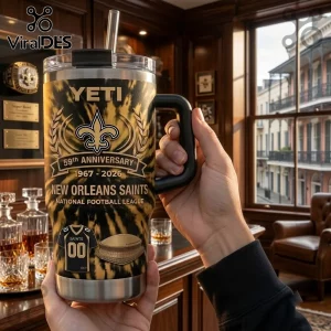 New Orleans Saints 59th Anniversary YETI Tumbler 40oz with gold and black tiger stripe pattern, team logo, and stadium graphic.