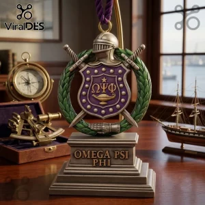 Omega Psi Phi Shield 2026 Christmas ornament features a purple crest with gold Greek letters, swords, and a green wreath.