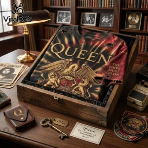 Queen The Show Must Go On tie dye t-shirt with gold crest graphic and distressed fabric details in a wooden display box.