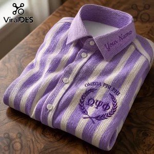 Omega Psi Phi Embroidered Striped Long Sleeve Button-Up Shirt in purple and white stripes with fraternity crest logo.
