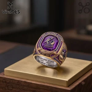 Melbourne Storm 30th Anniversary Commemorative Ring featuring a purple central gemstone, gold band, and rugby team logo.