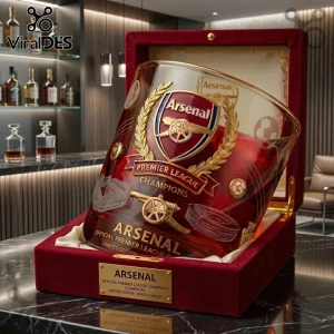 Arsenal FC Premier League Champions 2026 whiskey glass with red tint, gold crest, and stadium etching in a velvet case.