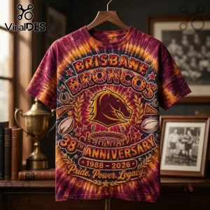 Brisbane Broncos 38th Anniversary Tie Dye Shirt featuring team horse logo, stadium graphic, and 1988-2026 text on maroon dye.