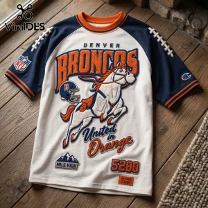 Denver Broncos 5280 Mile High embroidered shirt featuring a white base, navy sleeves, and orange team logo lettering.