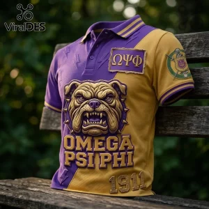 Omega Psi Phi Two-Tone Bulldog Polo Shirt featuring purple and gold panels, fraternity Greek letters, and mascot graphic.